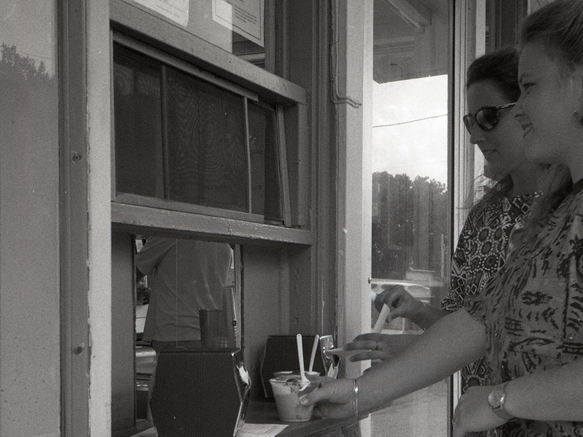 Two customers picking up their order at the walk-up window in 1994